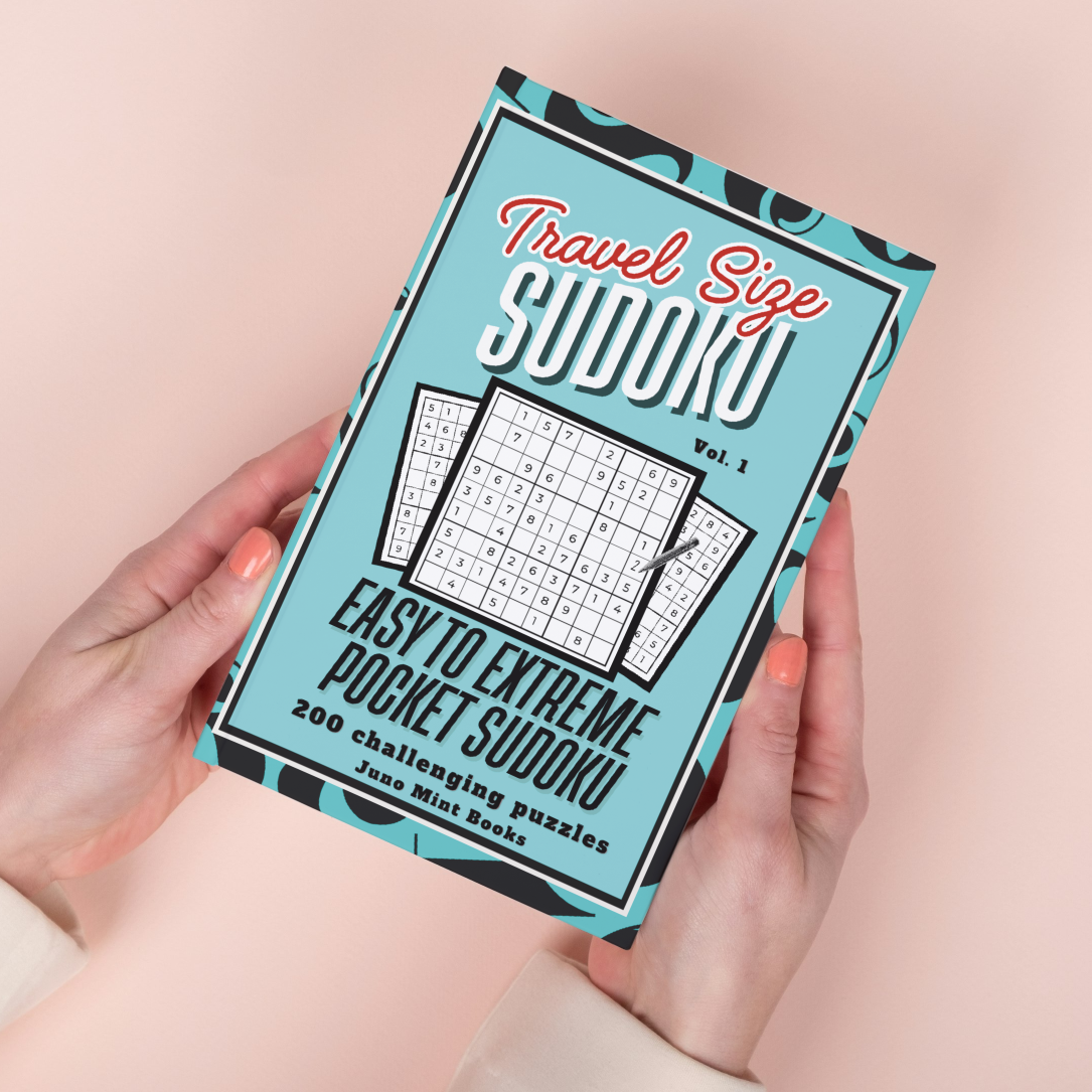 Travel Size Sudoku - Easy to Extreme Pocket Sudoku by Juno Mint Books Woman holding a blue travel size Sudoku puzzle book by Juno Mint Books